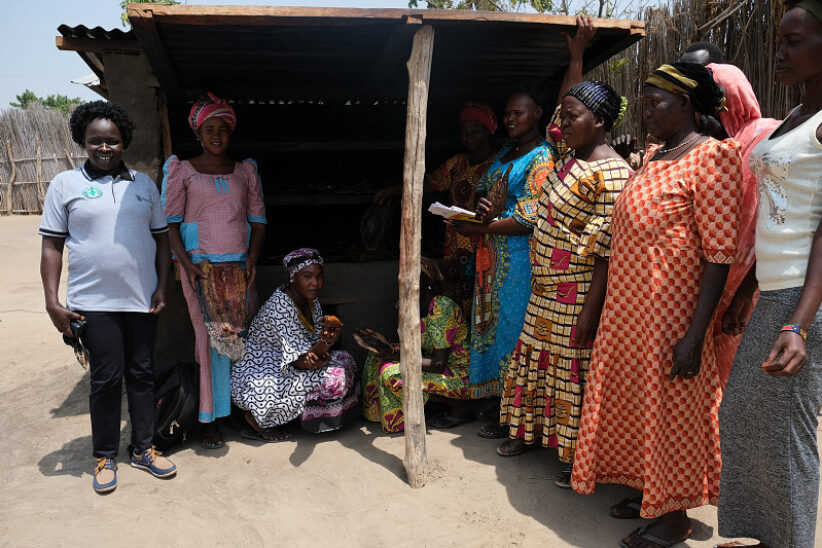 Womens Loan and savings group Terekeka in front of fish drying oven