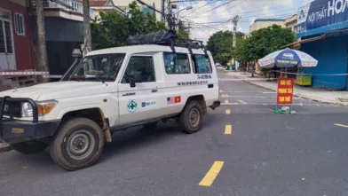 An NPA vehicle entering an area under lockdown where high risk groups are living