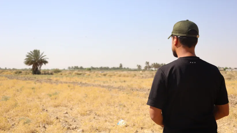 Mohammed looks over his land once mined now a safe and thriving farm