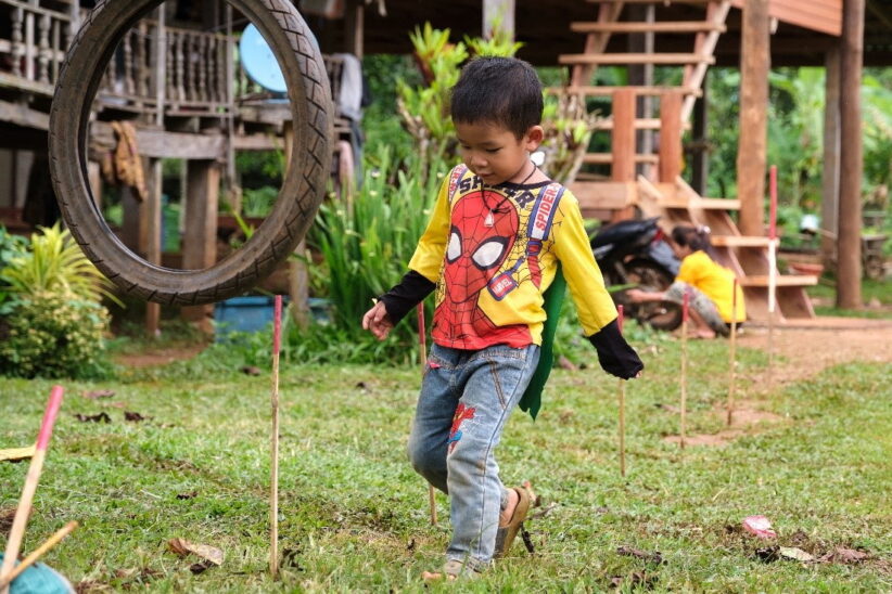 Boy plays in the backyard